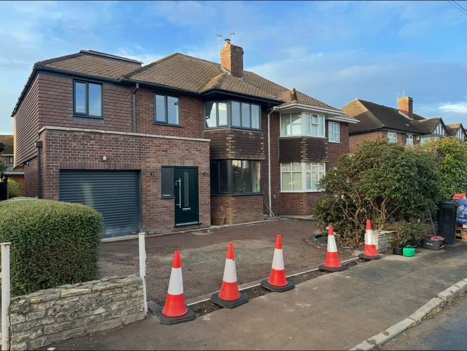 Excavated driveway marked out with cones ready for surfacing