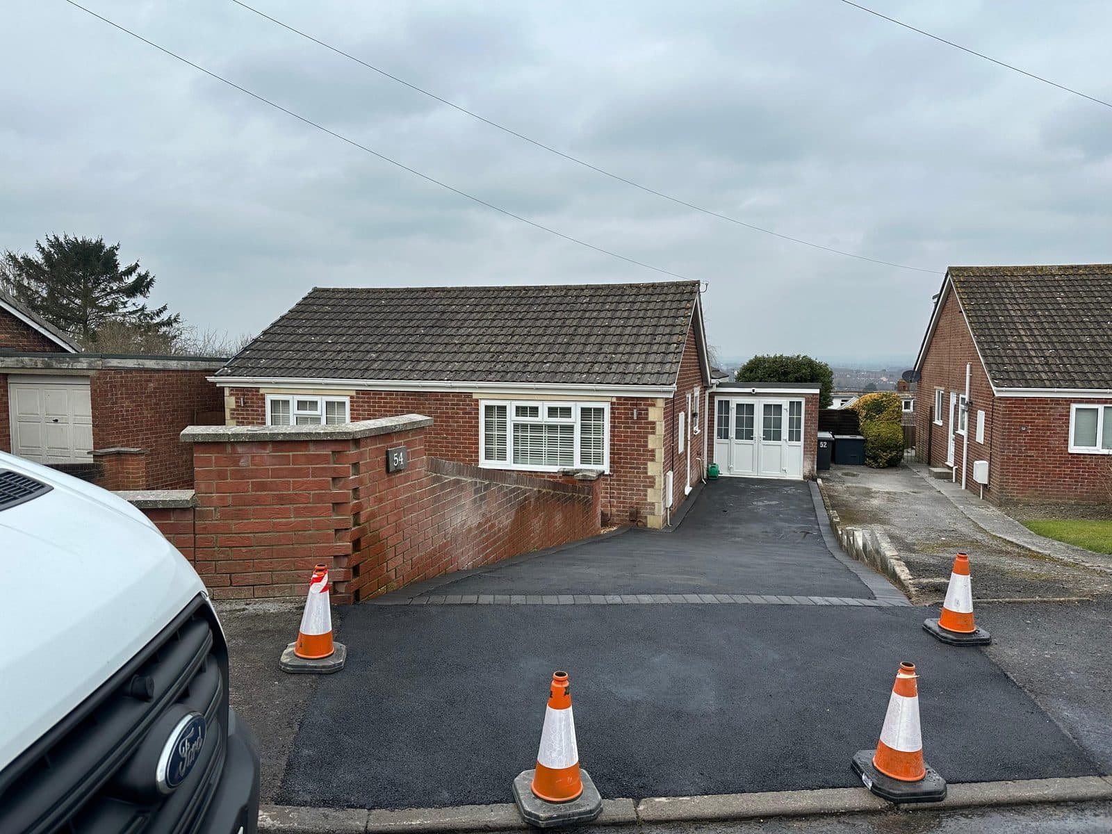 Compacted sub-base being prepared for a new block-paved driveway
